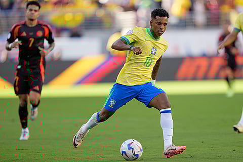 Brazil's Rodrygo goes with the ball